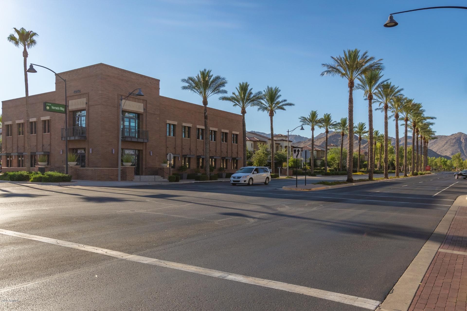 4280 North Verrado Way Buckeye, AZ 85396 - Photo 23 of 41 a view of a tall building next to a road