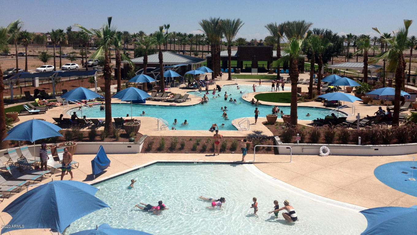 4280 North Verrado Way Buckeye, AZ 85396 - Photo 35 of 41 a view of swimming pool with outdoor seating