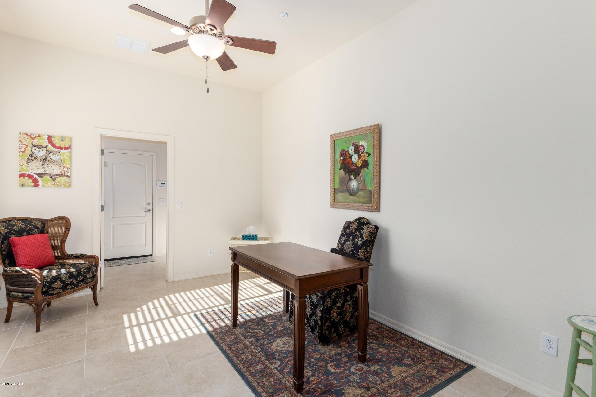 4280 North Verrado Way Buckeye, AZ 85396 - Photo 7 of 41 a view of a workspace with furniture and a workspace