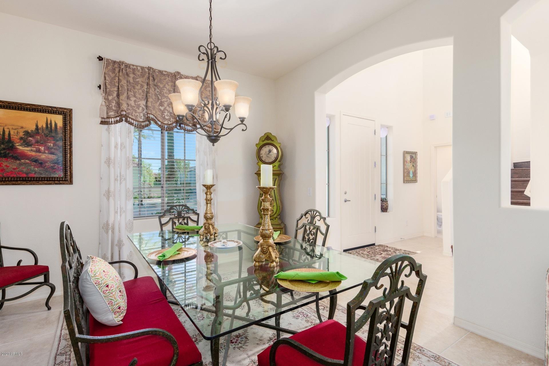4280 North Verrado Way Buckeye, AZ 85396 - Photo 9 of 41 a view of a dining room with furniture