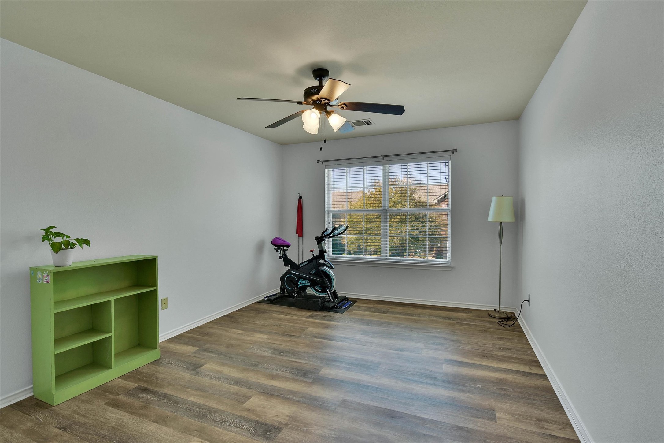 92 Verde Ranch Loop Leander, TX 78641 - Photo 15 of 37 Unfurnished room featuring dark wood-style floors and ceiling fan