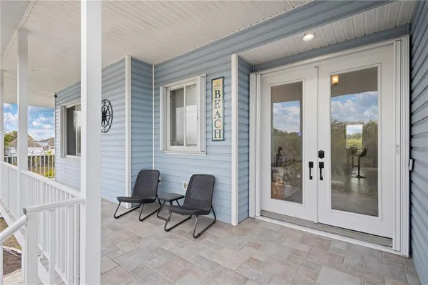 a kitchen with stainless steel appliances a refrigerator sink and cabinets