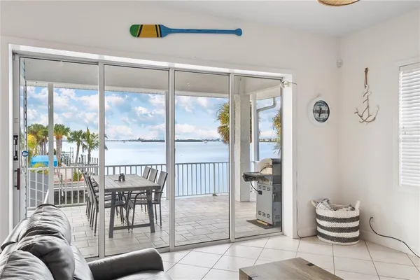 a bedroom with a bed and a dresser next to a window