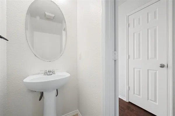 a bathroom with a sink a mirror and a toilet