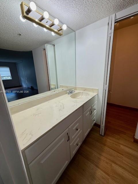 3910 Inverrary Boulevard, Unit 407B Lauderhill, FL 33319 - Photo 13 of 28 a bathroom with a double vanity sink and a mirror
