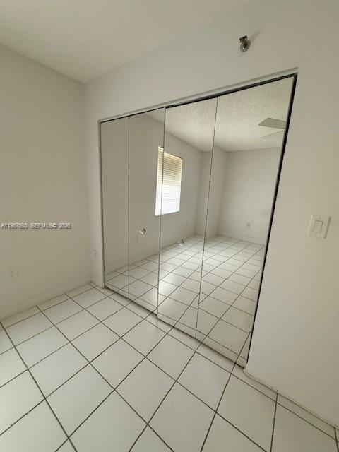 3910 Inverrary Boulevard, Unit 407B Lauderhill, FL 33319 - Photo 16 of 28 a bathroom with a shower and a tiled wall