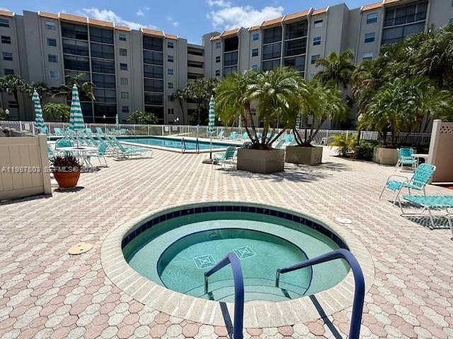 3910 Inverrary Boulevard, Unit 407B Lauderhill, FL 33319 - Photo 23 of 28 a view of swimming pool with outdoor seating and plants
