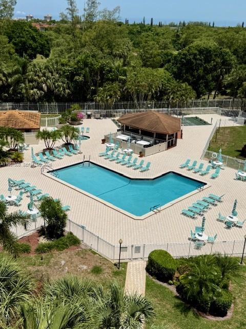 3910 Inverrary Boulevard, Unit 407B Lauderhill, FL 33319 - Photo 27 of 28 a view of a swimming pool with a yard