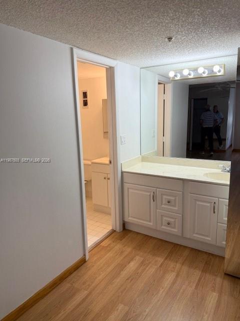 3910 Inverrary Boulevard, Unit 407B Lauderhill, FL 33319 - Photo 9 of 28 a bathroom with a granite countertop sink mirror and toilet