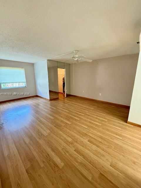 3910 Inverrary Boulevard, Unit 407B Lauderhill, FL 33319 - Photo 10 of 28 an empty room with wooden floor and windows