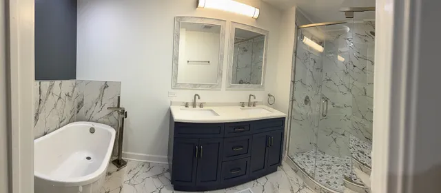 a bathroom with a sink toilet a mirror and shower