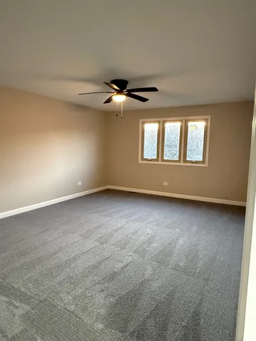 a bathroom with a toilet and bathtub