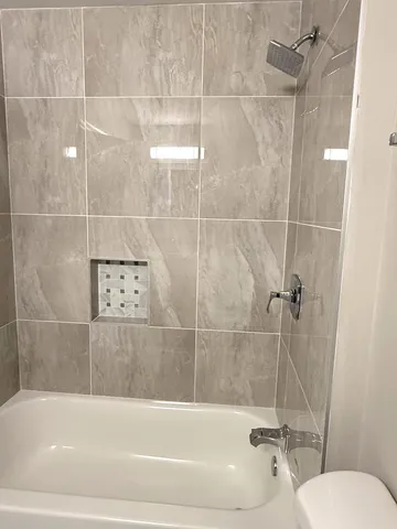 a large kitchen with granite countertop a sink and a stove