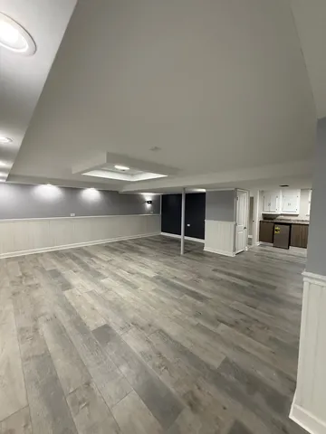a view of staircase with railing and a ceiling fan
