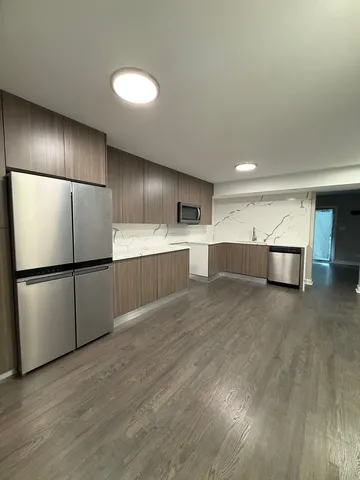 a view of kitchen with furniture and wooden floor