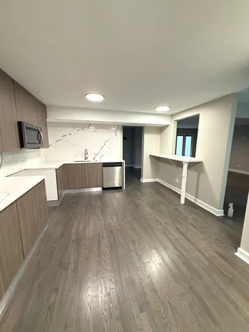 a view of kitchen with wooden floor