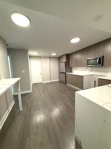 a view of kitchen with wooden floor