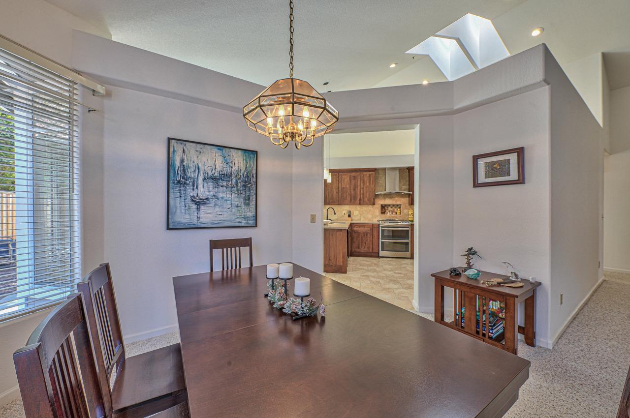 17644 River Run Road Salinas, CA 93908 - Photo 11 of 41 a view of a dining room with furniture wooden floor and chandelier