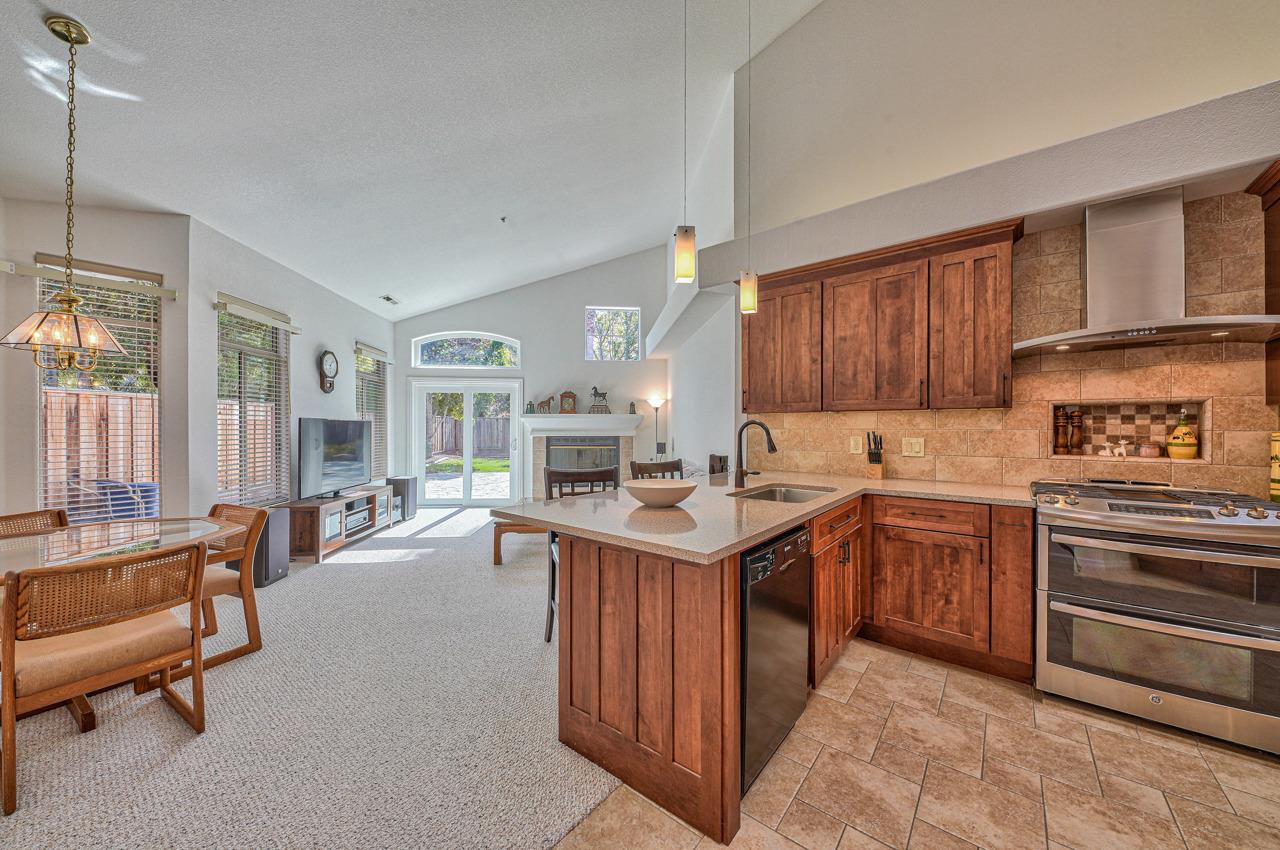 17644 River Run Road Salinas, CA 93908 - Photo 13 of 41 a kitchen with a sink stove and wooden cabinets