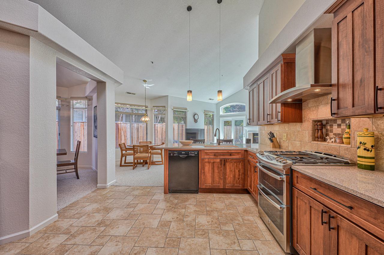 17644 River Run Road Salinas, CA 93908 - Photo 14 of 41 a kitchen with stainless steel appliances granite countertop a stove top oven a sink dishwasher and cabinets