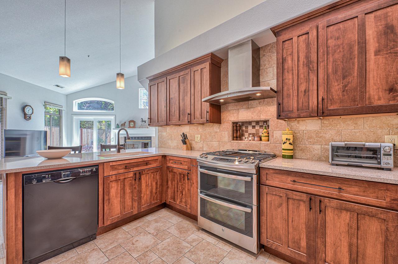 17644 River Run Road Salinas, CA 93908 - Photo 15 of 41 a kitchen with stainless steel appliances granite countertop a stove sink and cabinets