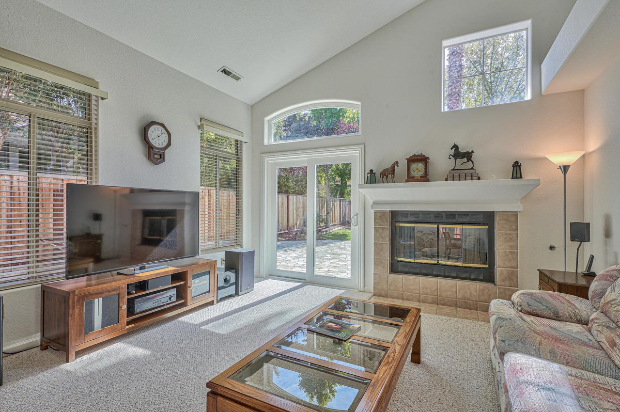 17644 River Run Road Salinas, CA 93908 - Photo 20 of 41 a living room with furniture a flat screen tv and a fireplace