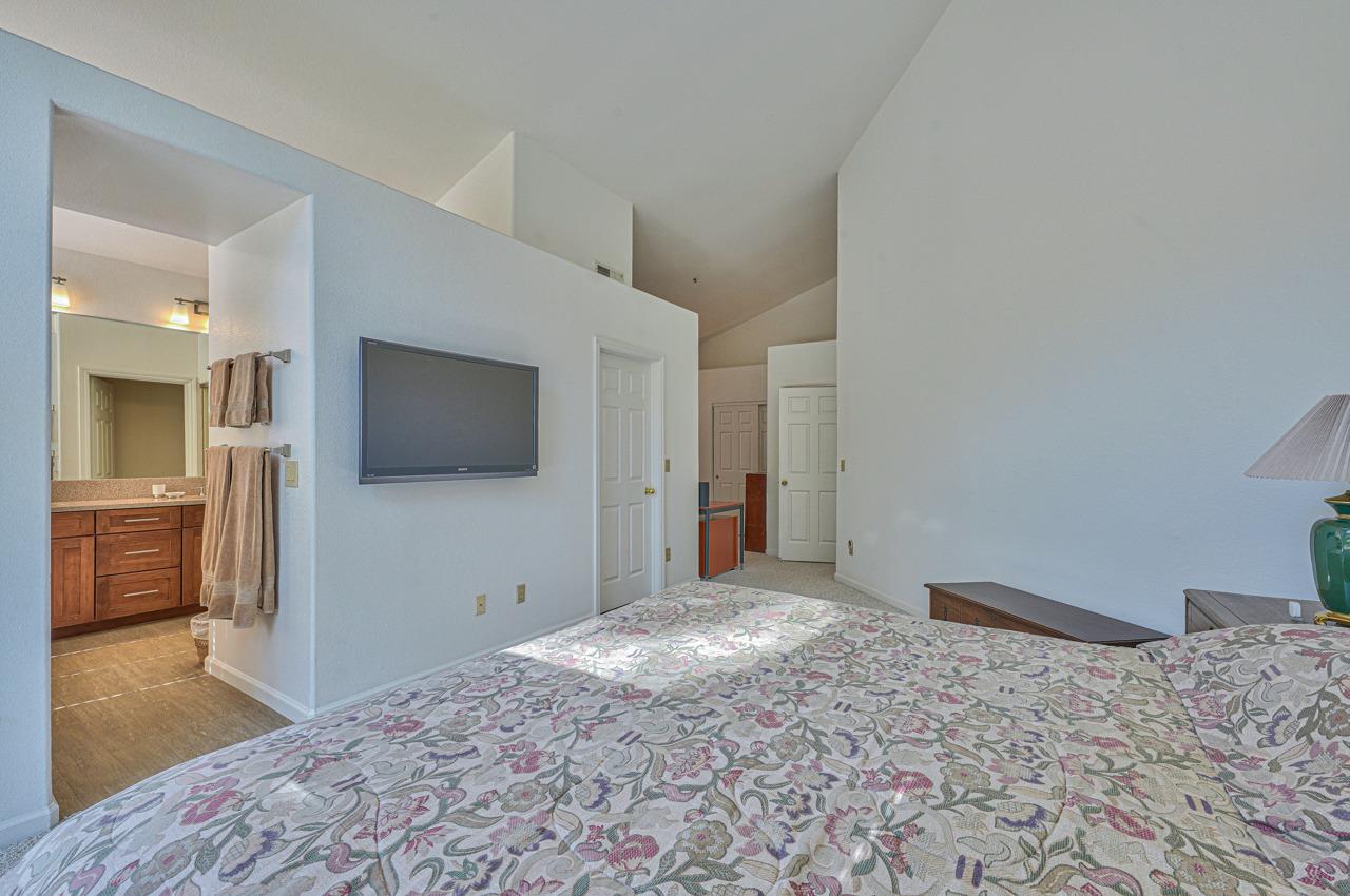 17644 River Run Road Salinas, CA 93908 - Photo 27 of 41 a bedroom with a bed and a flat screen tv