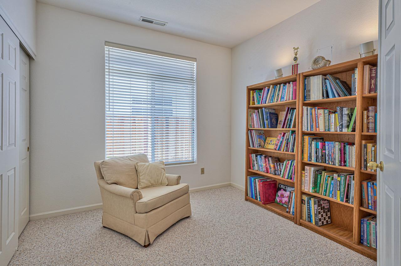 17644 River Run Road Salinas, CA 93908 - Photo 34 of 41 a living room with furniture and a book shelf