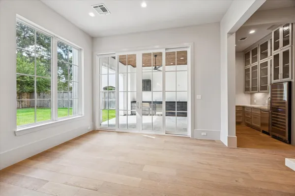 a view of an empty room with cabinet