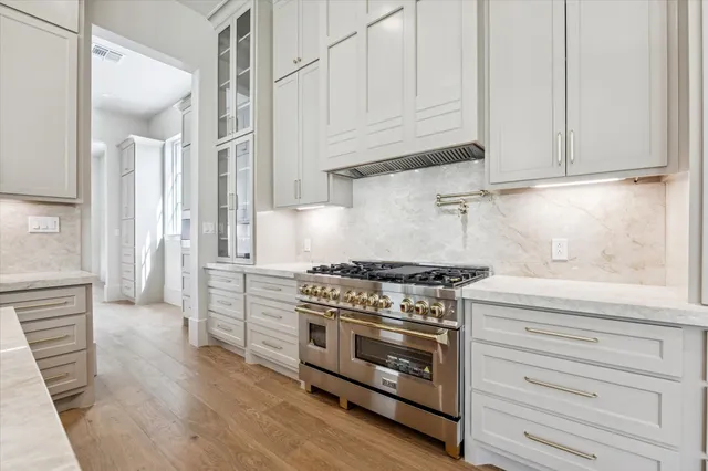 a bathroom with a sink and a refrigerator