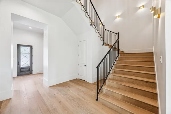 a view of entryway with wooden floor