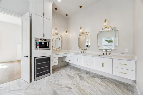 a spacious bathroom with a bathtub shower and toilet