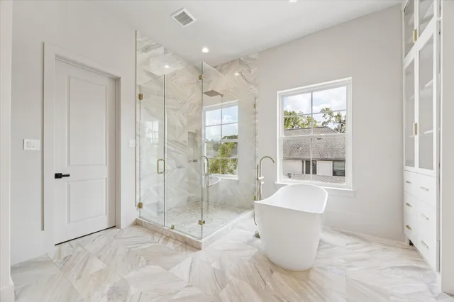 a spacious bathroom with a double vanity sink mirror and