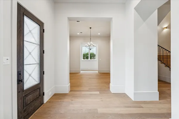 a view of an entryway door and hallway