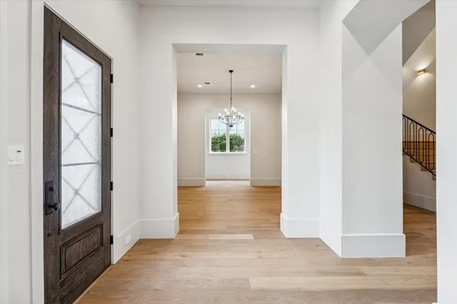 a view of an entryway door and hallway