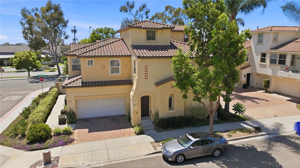 3603 Jetty Carlsbad, CA 92010 - Photo 32 of 43 a front view of a house with a garden