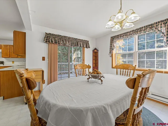 a bedroom with furniture and a large window