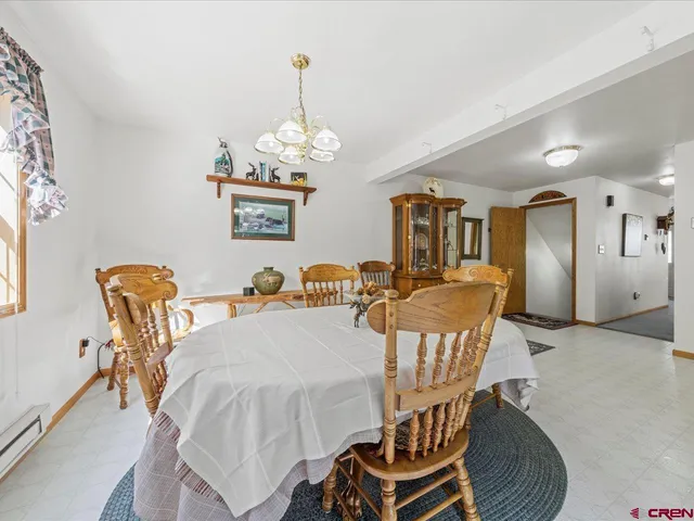a very nice looking dining room with furniture