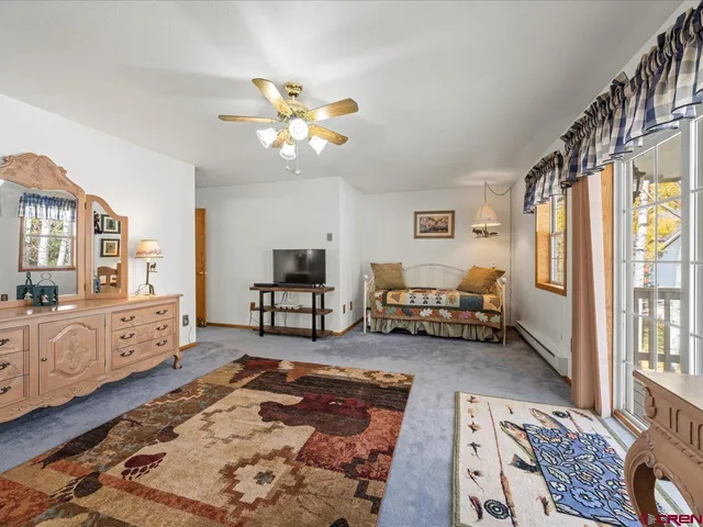 a bed room with furniture and a window