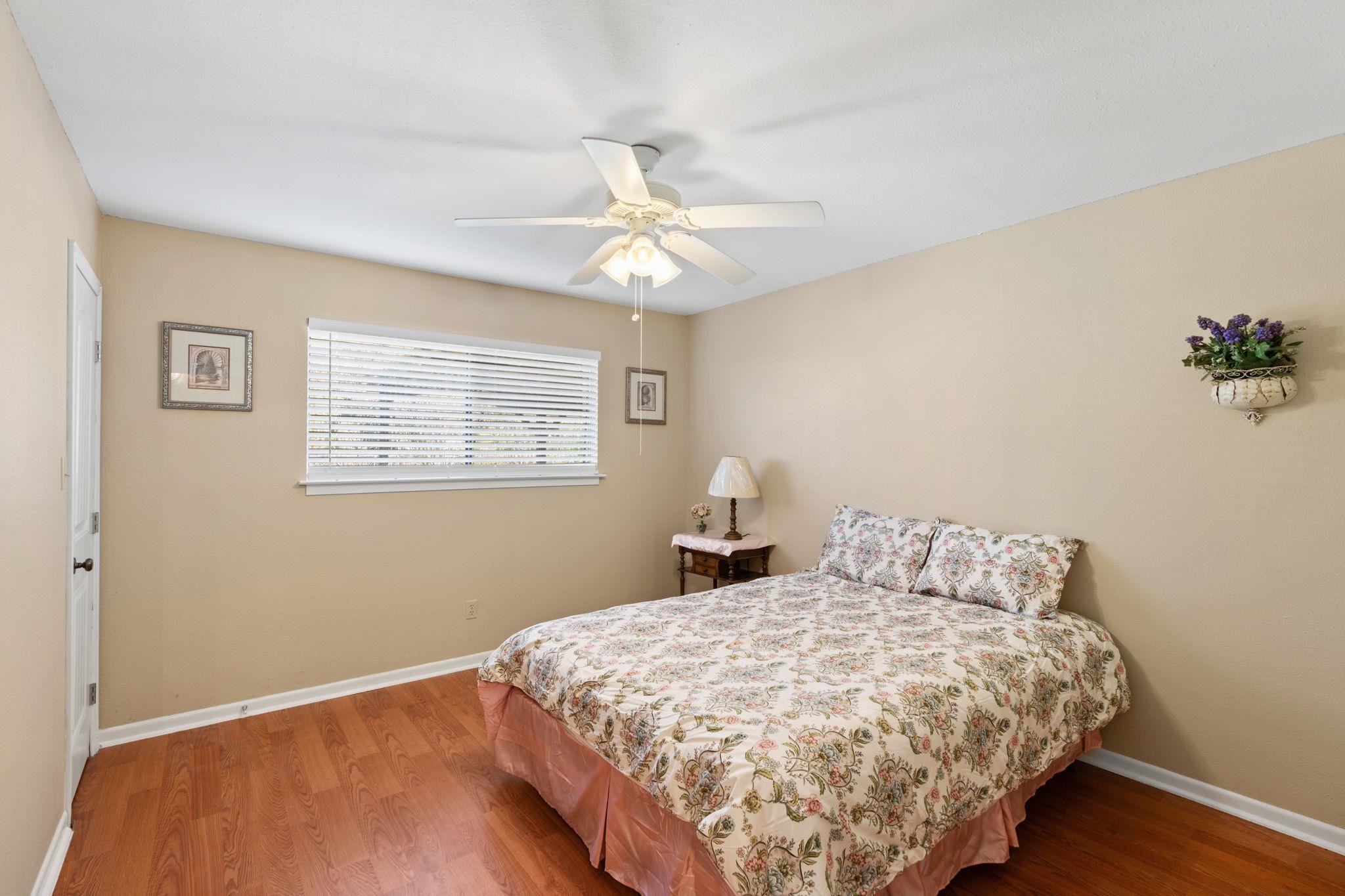 418 Hernandos Loop Leander, TX 78641 - Photo 17 of 24 a bedroom with a bed and a chandelier