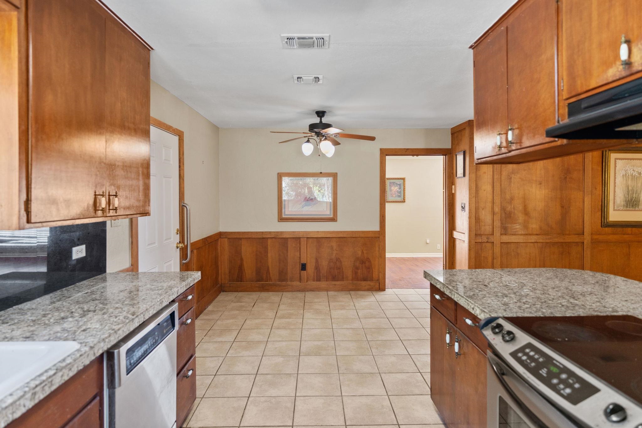418 Hernandos Loop Leander, TX 78641 - Photo 18 of 24 a kitchen with a stove a sink and a refrigerator