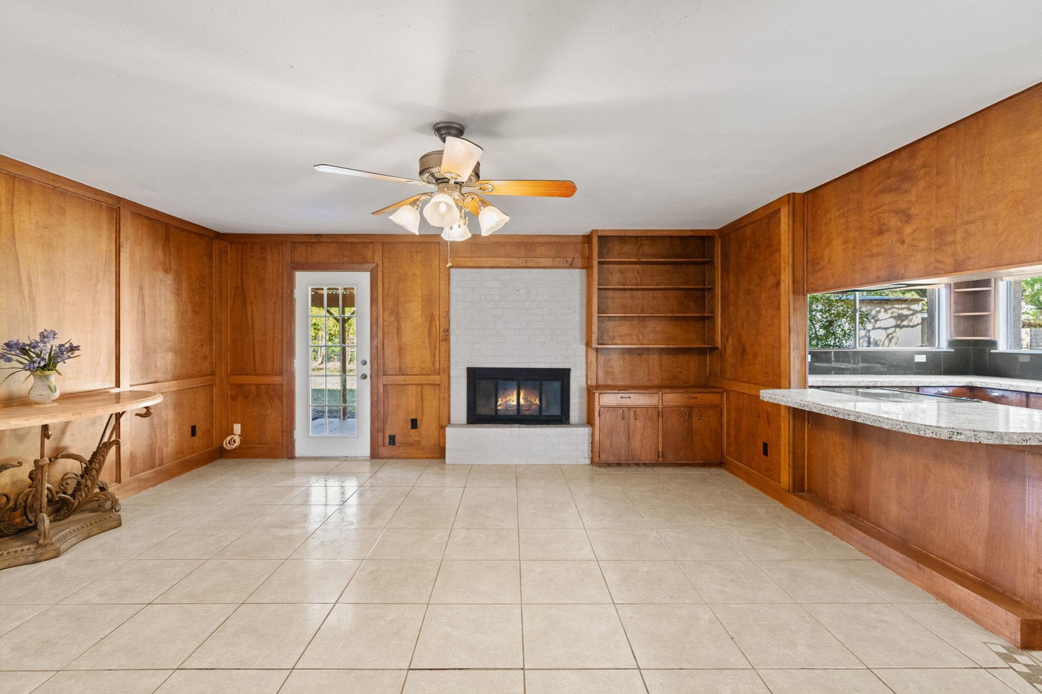 418 Hernandos Loop Leander, TX 78641 - Photo 19 of 24 a view of an empty room with a fireplace and a window