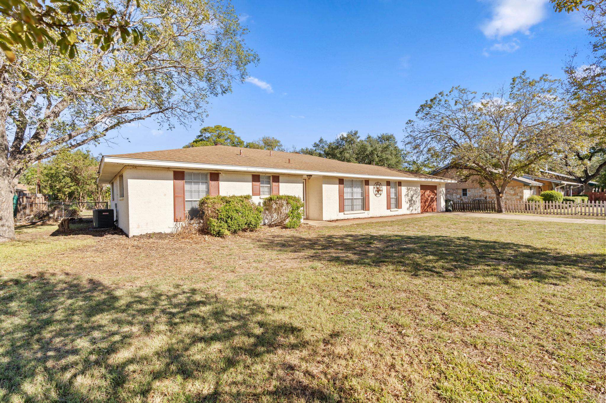 418 Hernandos Loop Leander, TX 78641 - Photo 2 of 24 a front view of a house with a garden