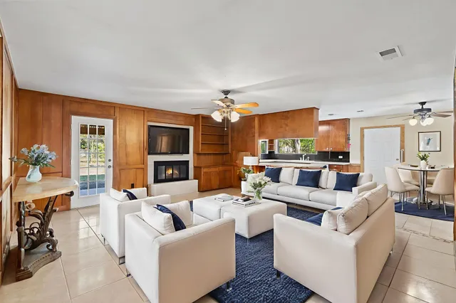 a kitchen with stainless steel appliances granite countertop a sink counter space and a stove
