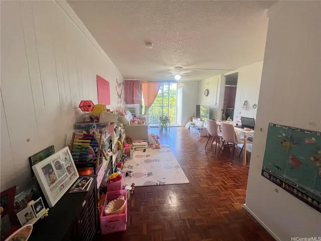 a view of a livingroom with furniture and a flat screen tv