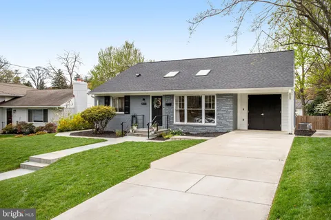 a front view of a house with that has a yard