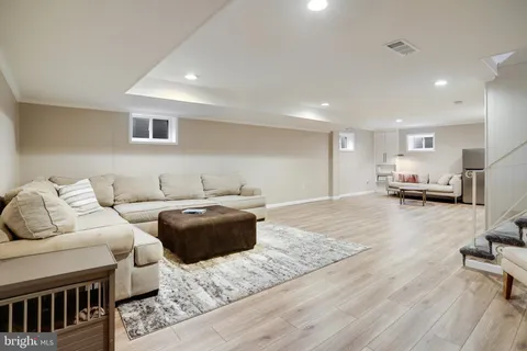 a view of a house with a yard and sitting area