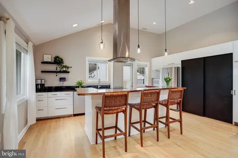 a kitchen with a sink and a refrigerator