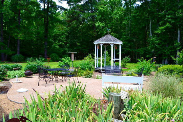 10306 Buckley Hall Road Mathews, VA 23109 - Photo 3 of 22 a view of a garden with a patio