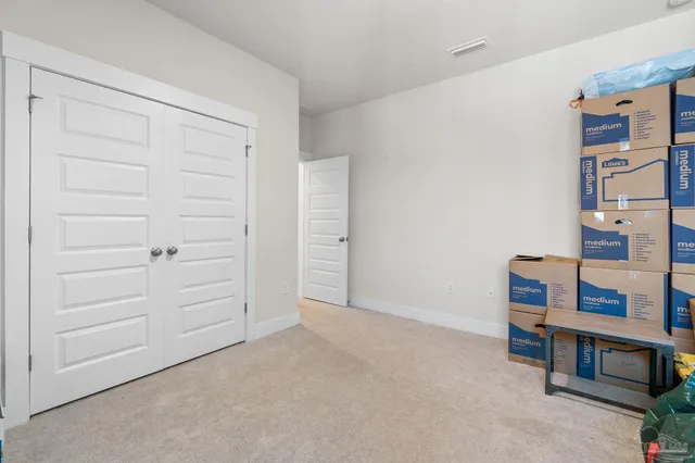 wooden floor and cabinet in front of room